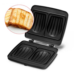 Appareil à sandwich ouvert, noir, avec toasts grillés.